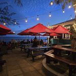 Outdoor dining at Blakey’s Bar and Restaurant overlooking the ocean on the Hastings Boardwalk in Barbados